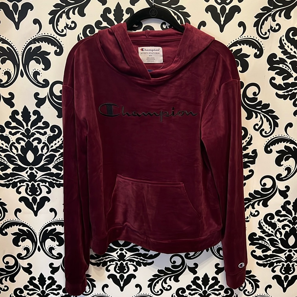 Brand new, with tags. Champion plum color velvet sweatshirt.